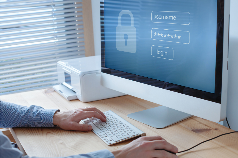 Man using login and password to access secured data on computer