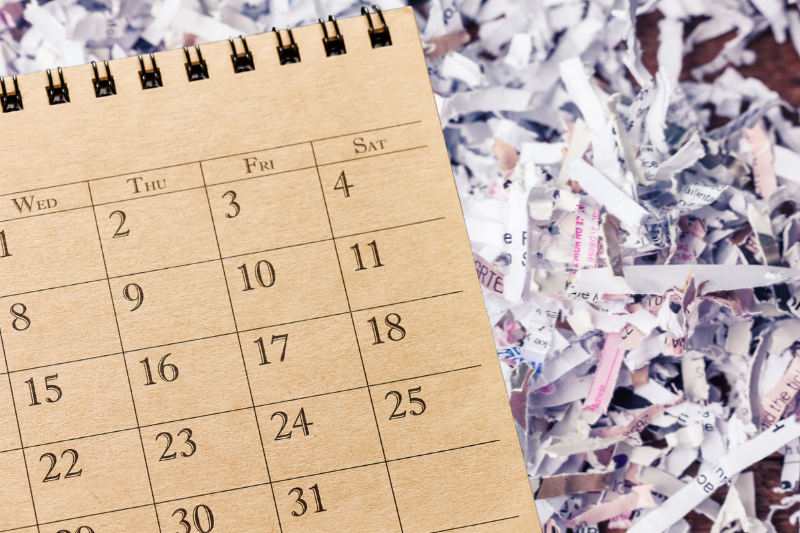 Calendar on a background of shredded documents