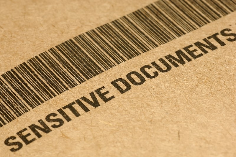 Barcode on a folder labeled, "Sensitive Documents"