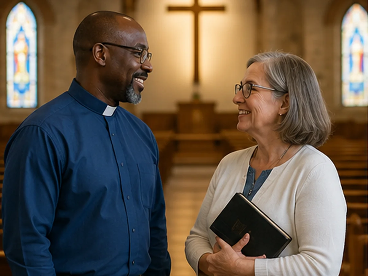 Church leader speaking with a member inside a church